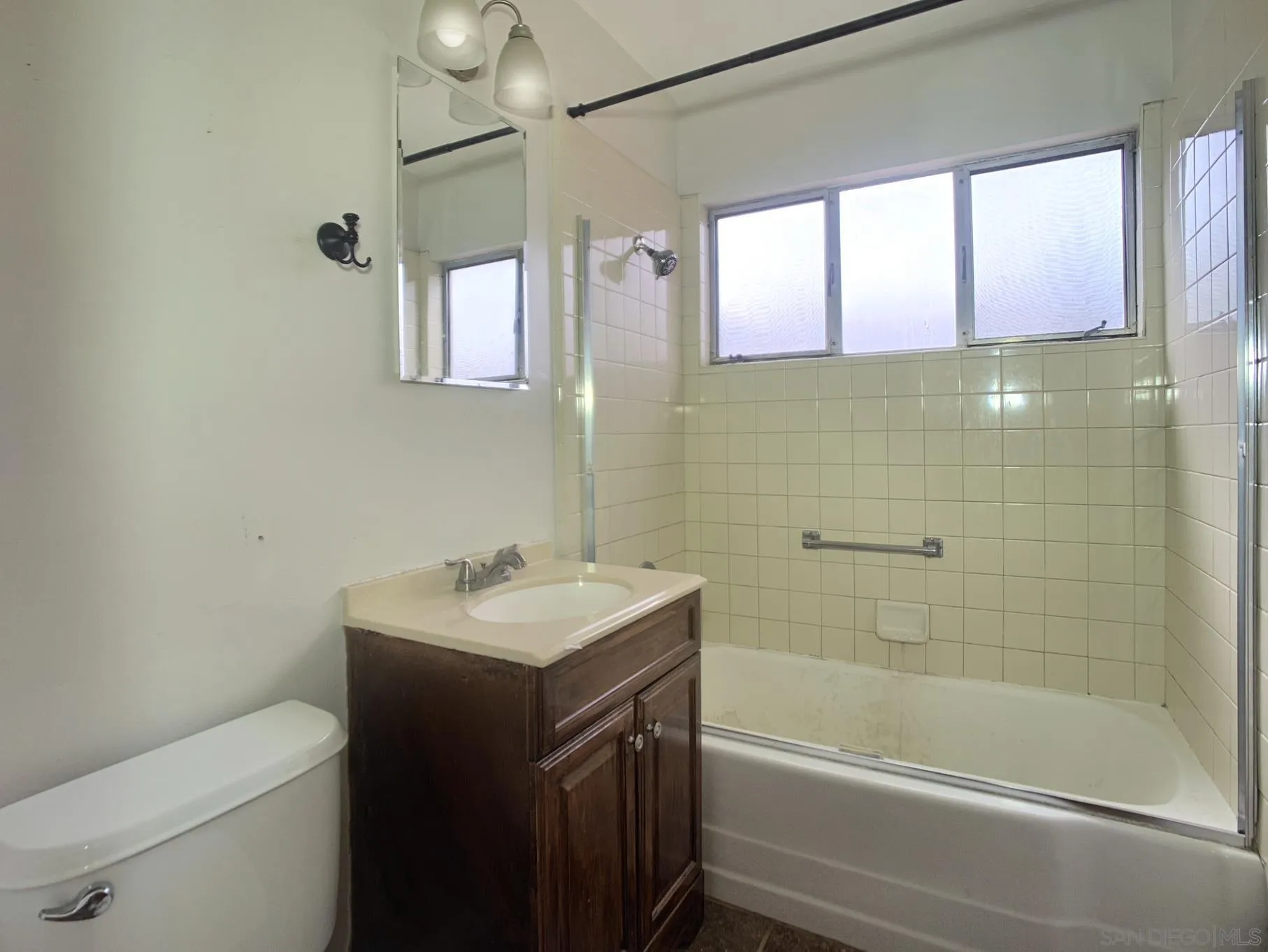 4240 Camino Paz La Mesa, CA 91941 - Photo 20 of 33 a bathroom with a sink toilet vanity and shower