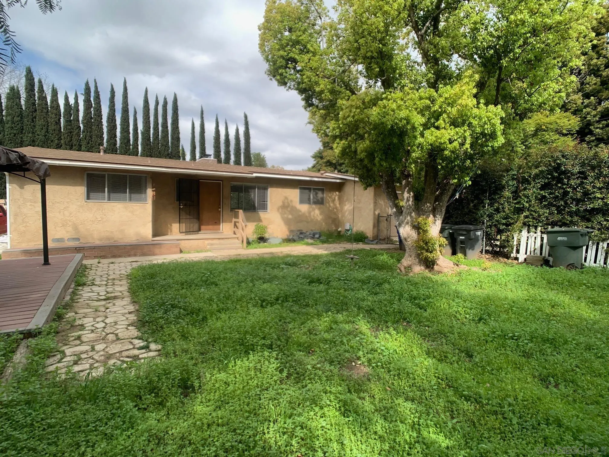 4240 Camino Paz La Mesa, CA 91941 - Photo 23 of 33 a front view of a house with garden