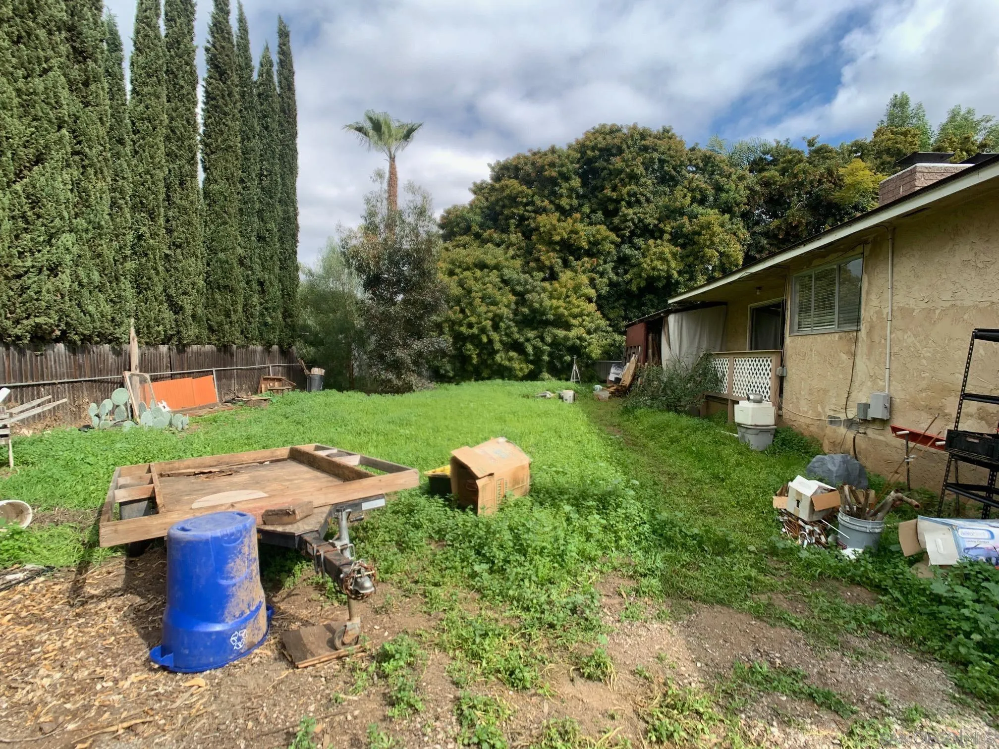 4240 Camino Paz La Mesa, CA 91941 - Photo 28 of 33 a view of a yard with table and chairs potted plants and large tree