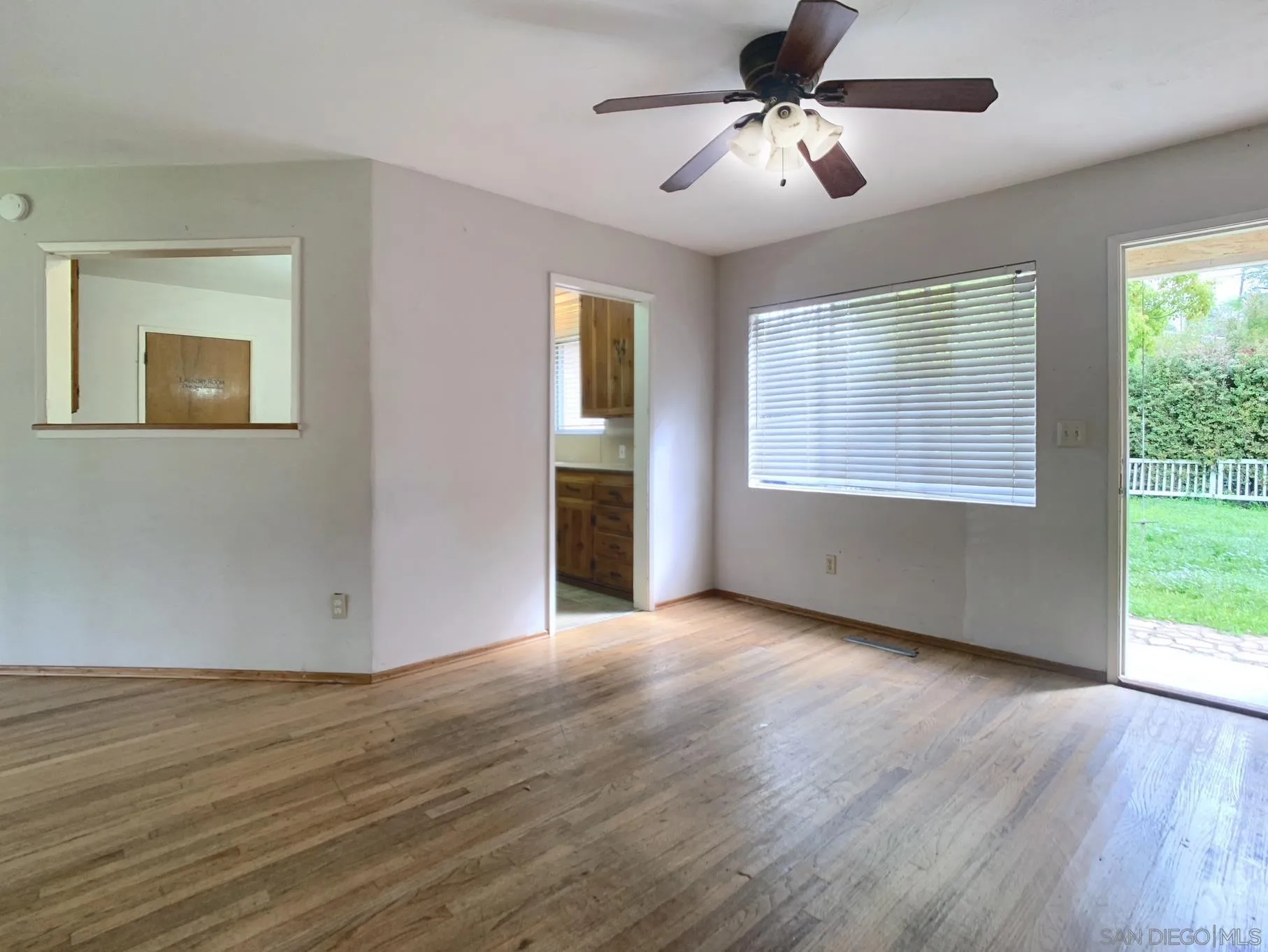 4240 Camino Paz La Mesa, CA 91941 - Photo 7 of 33 a view of an empty room with wooden floor and a window