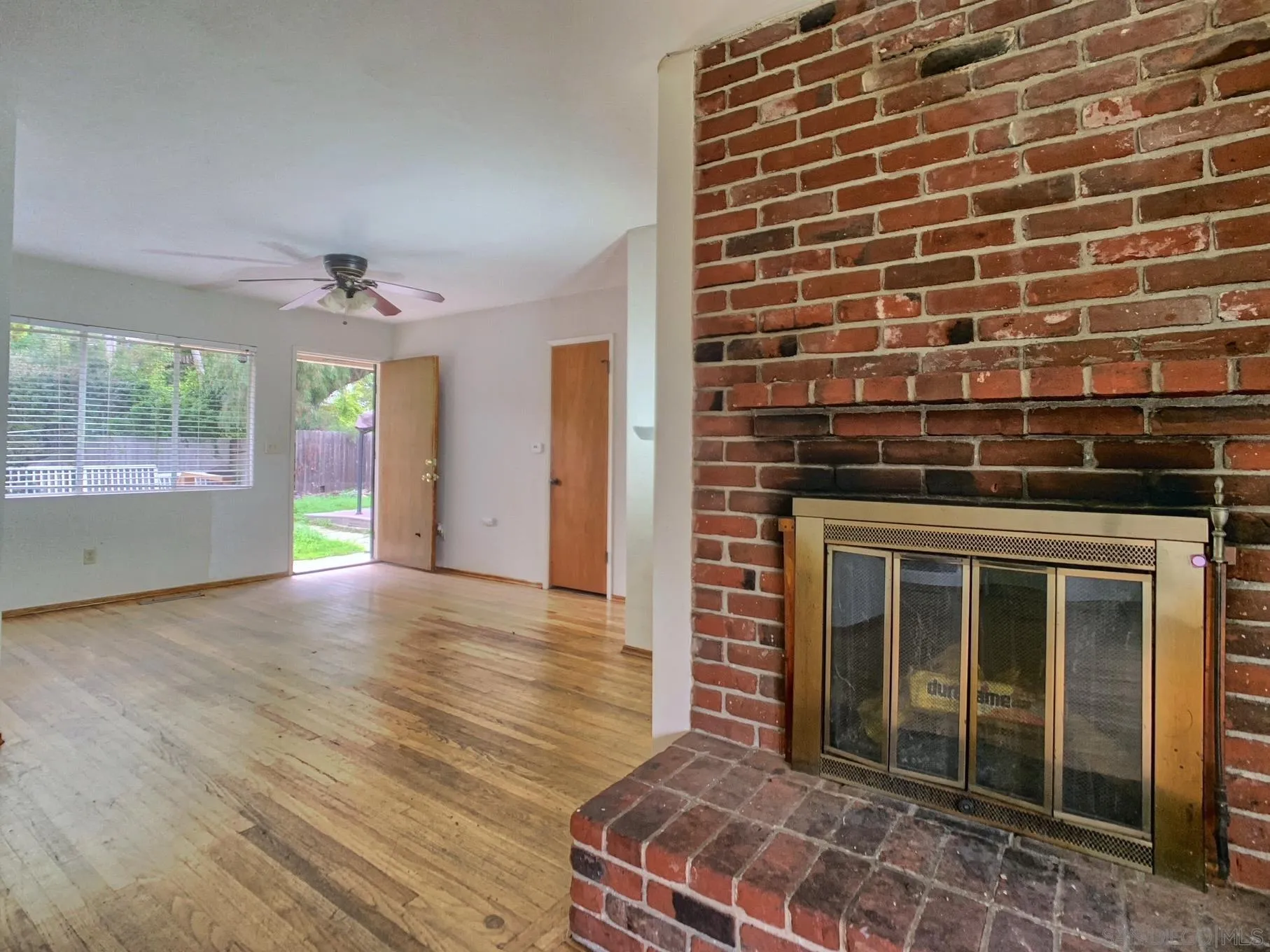 4240 Camino Paz La Mesa, CA 91941 - Photo 9 of 33 a view of an empty room with wooden floor and a window