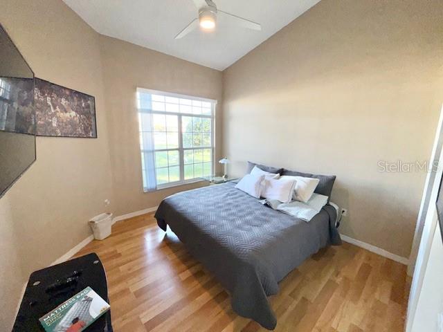 319 Green Reed Road DeBary, FL 32713 - Photo 11 of 21 a bedroom with a bed and wooden floor