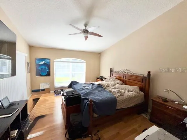 a bedroom with bed and window