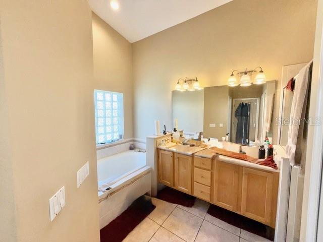 319 Green Reed Road DeBary, FL 32713 - Photo 15 of 21 a bathroom with a double vanity sink mirror and bathtub