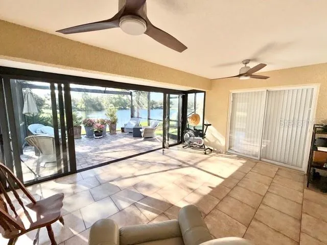 a view of a living room and a patio area