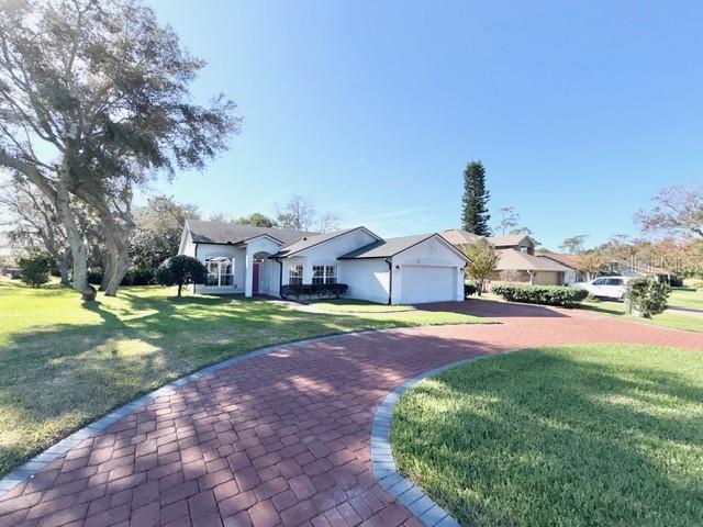 319 Green Reed Road DeBary, FL 32713 - Photo 3 of 21 a front view of a house with garden