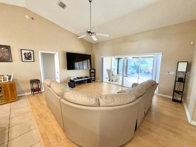 319 Green Reed Road DeBary, FL 32713 - Photo 4 of 21 a living room with patio furniture and a flat screen tv