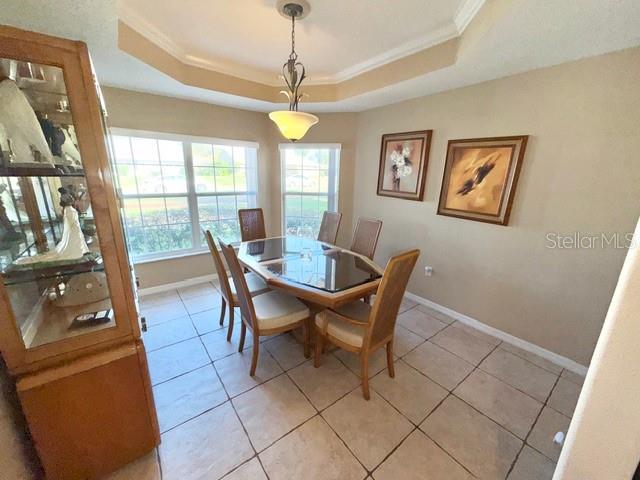 319 Green Reed Road DeBary, FL 32713 - Photo 6 of 21 a view of a dining room with furniture a chandelier and a window