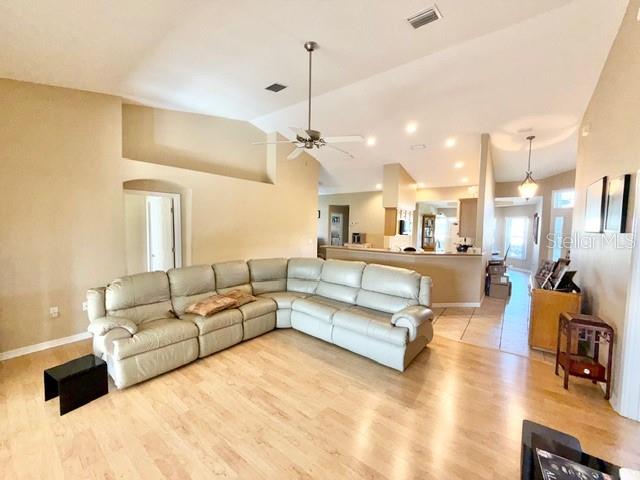 319 Green Reed Road DeBary, FL 32713 - Photo 9 of 21 a living room with furniture and a chandelier