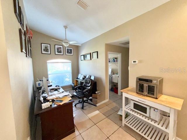 319 Green Reed Road DeBary, FL 32713 - Photo 10 of 21 a living room with furniture a fireplace and a flat screen tv