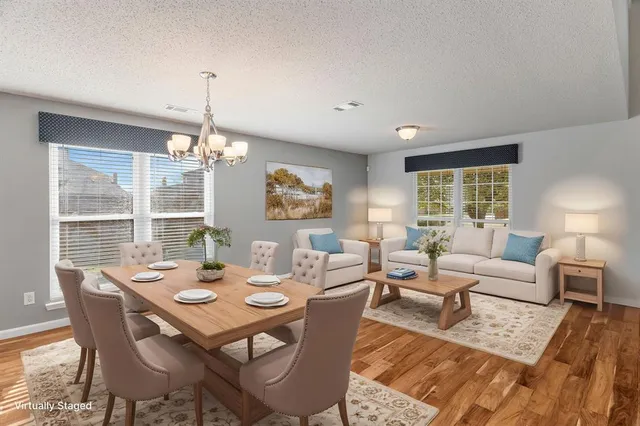 a view of a dining room with furniture window and outside view