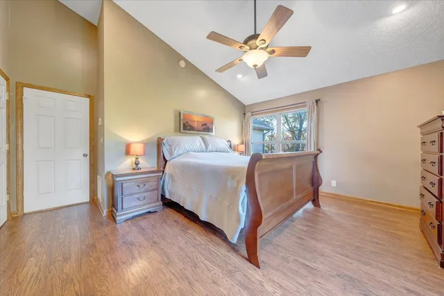 a view of a workspace with furniture and a gate