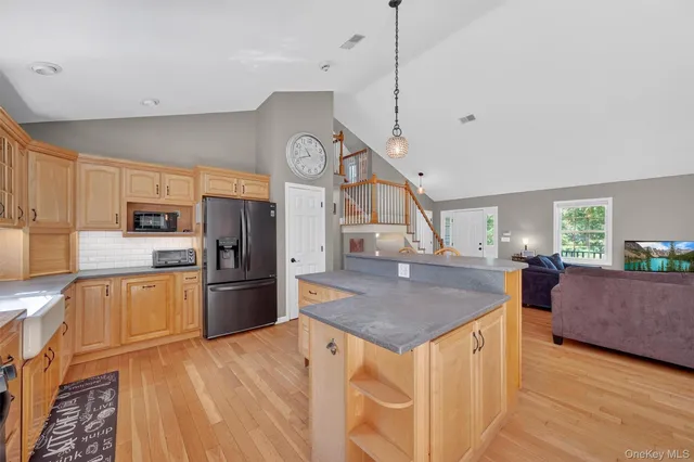 a view of a house with backyard sitting area and garden