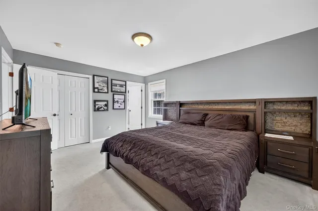 a kitchen with granite countertop stainless steel appliances a sink and a window