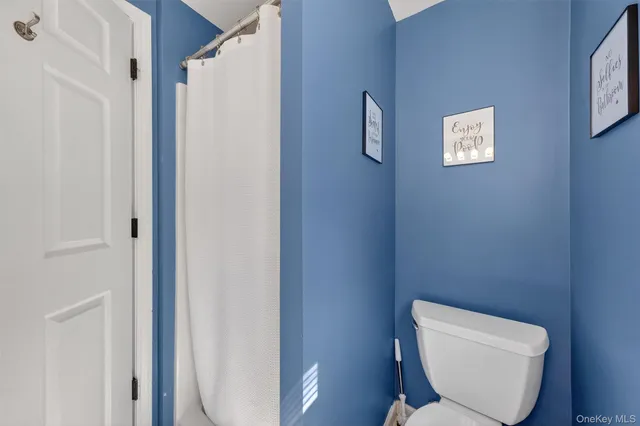 a bathroom with a sink vanity and a mirror