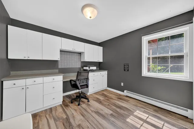 a white toilet sitting next to a white walls
