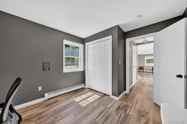 a kitchen with a refrigerator stove and white cabinets