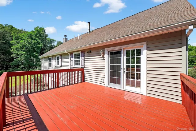 a balcony with trees in front of it