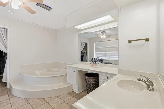 a bathroom with a sink toilet and mirror