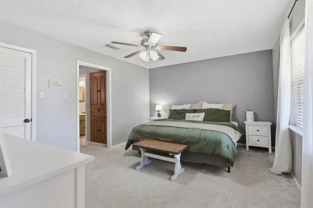 a bedroom with furniture and a couch