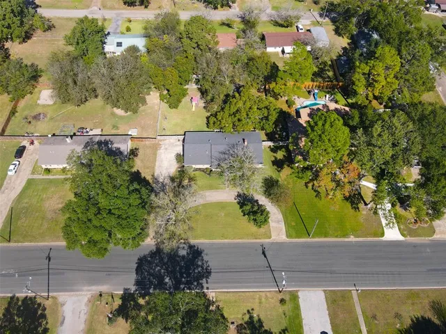 an aerial view of a house with a garden