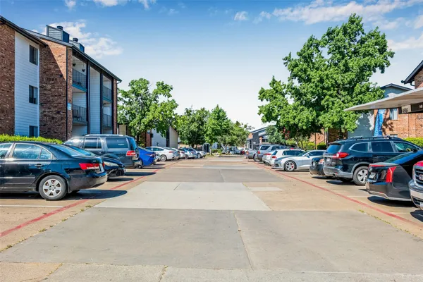 a view of a cars parked in front of a house