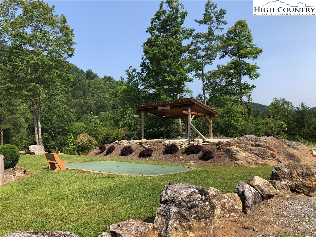 Lot 27 Wolf Pen Road Purlear, NC 28665 - Photo 47 of 48 a view of a wooden house with a yard