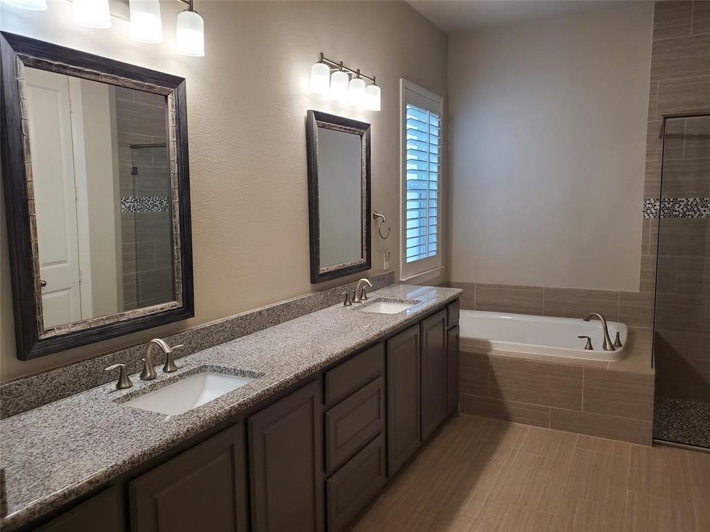 2846 Lotus Street Carrollton, TX 75007 - Photo 12 of 21 a bathroom with a granite countertop sink and a mirror