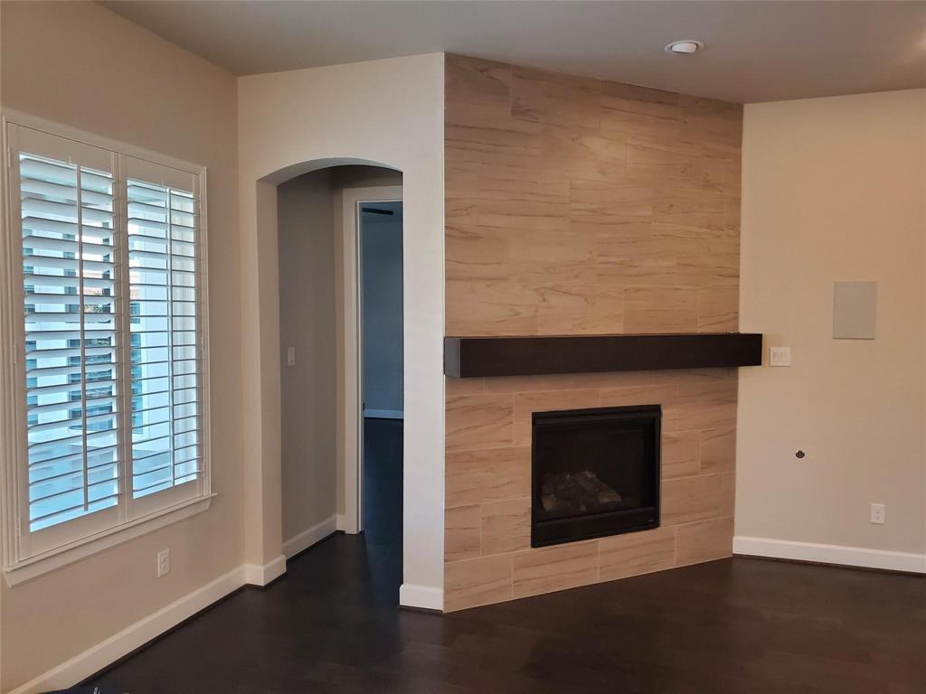 2846 Lotus Street Carrollton, TX 75007 - Photo 15 of 21 a view of an empty room with wooden floor and a window