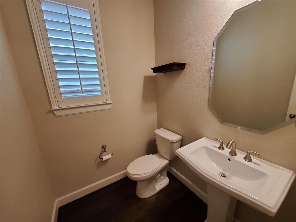 2846 Lotus Street Carrollton, TX 75007 - Photo 18 of 21 a bathroom with a sink and a toilet