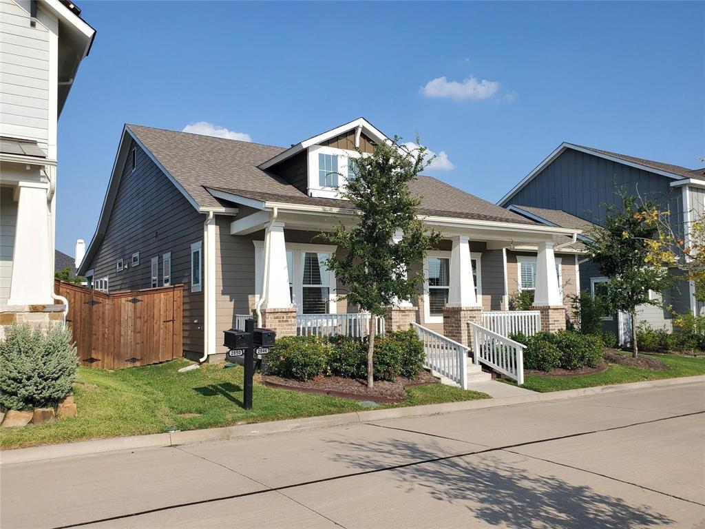 2846 Lotus Street Carrollton, TX 75007 - Photo 2 of 21 a front view of a house with garden