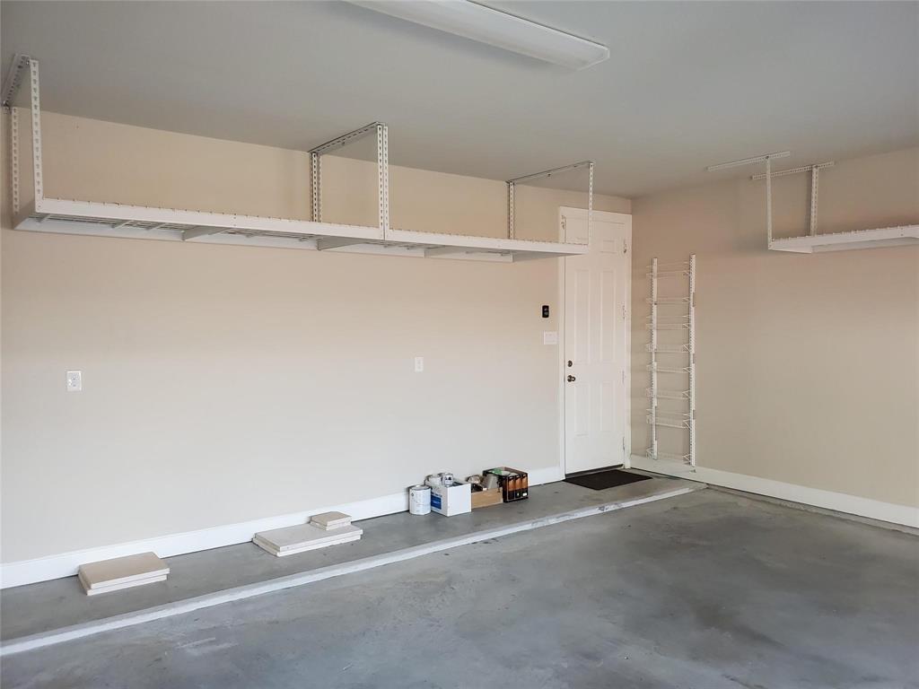 2846 Lotus Street Carrollton, TX 75007 - Photo 21 of 21 a room with a closet and wooden floor