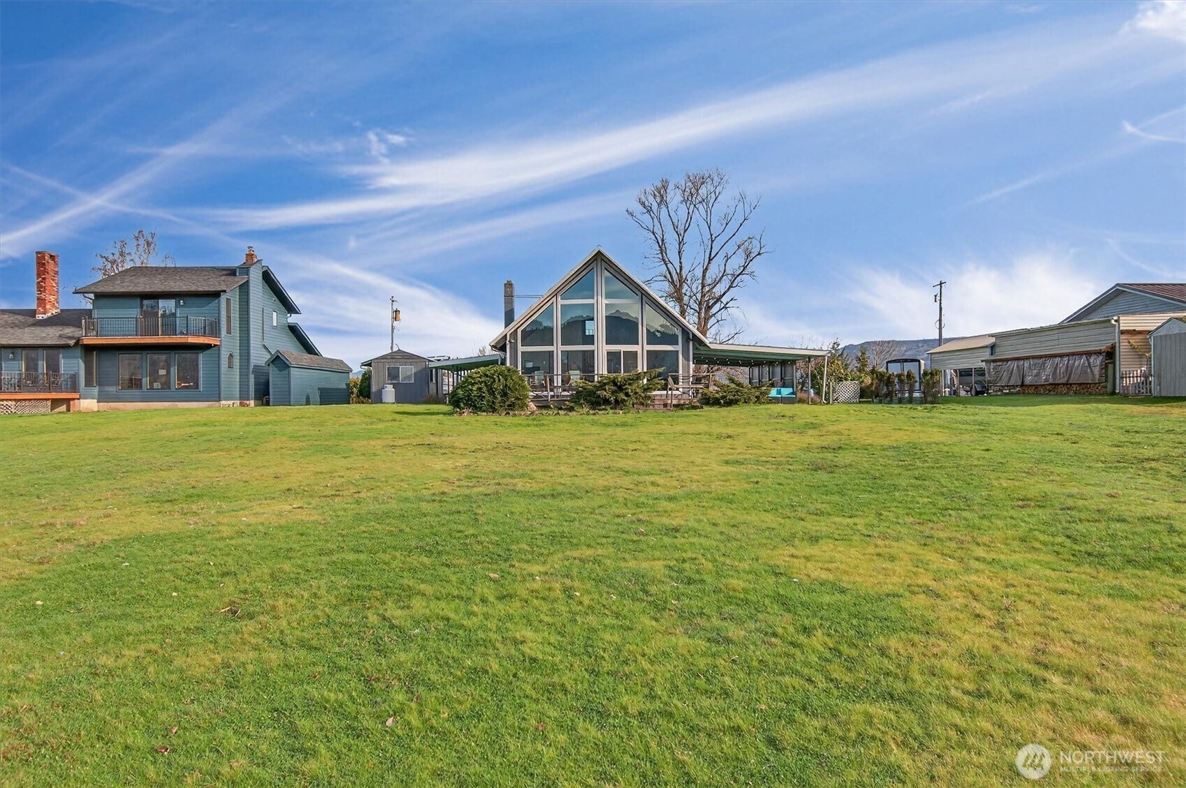 301 West Sunny Sands Road Cathlamet, WA 98612 - Photo 11 of 39 a view of a large pool with lawn chairs and a big yard