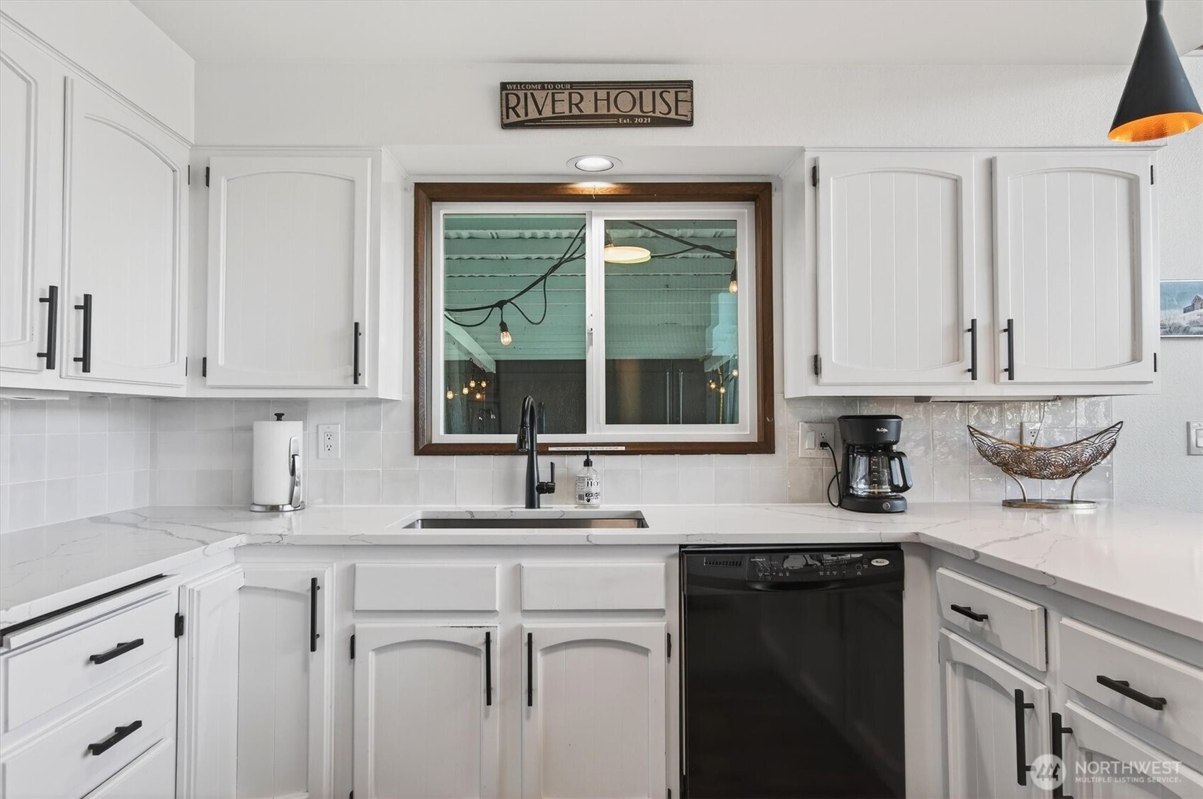 301 West Sunny Sands Road Cathlamet, WA 98612 - Photo 24 of 39 a kitchen with stainless steel appliances granite countertop a sink a stove and white cabinets