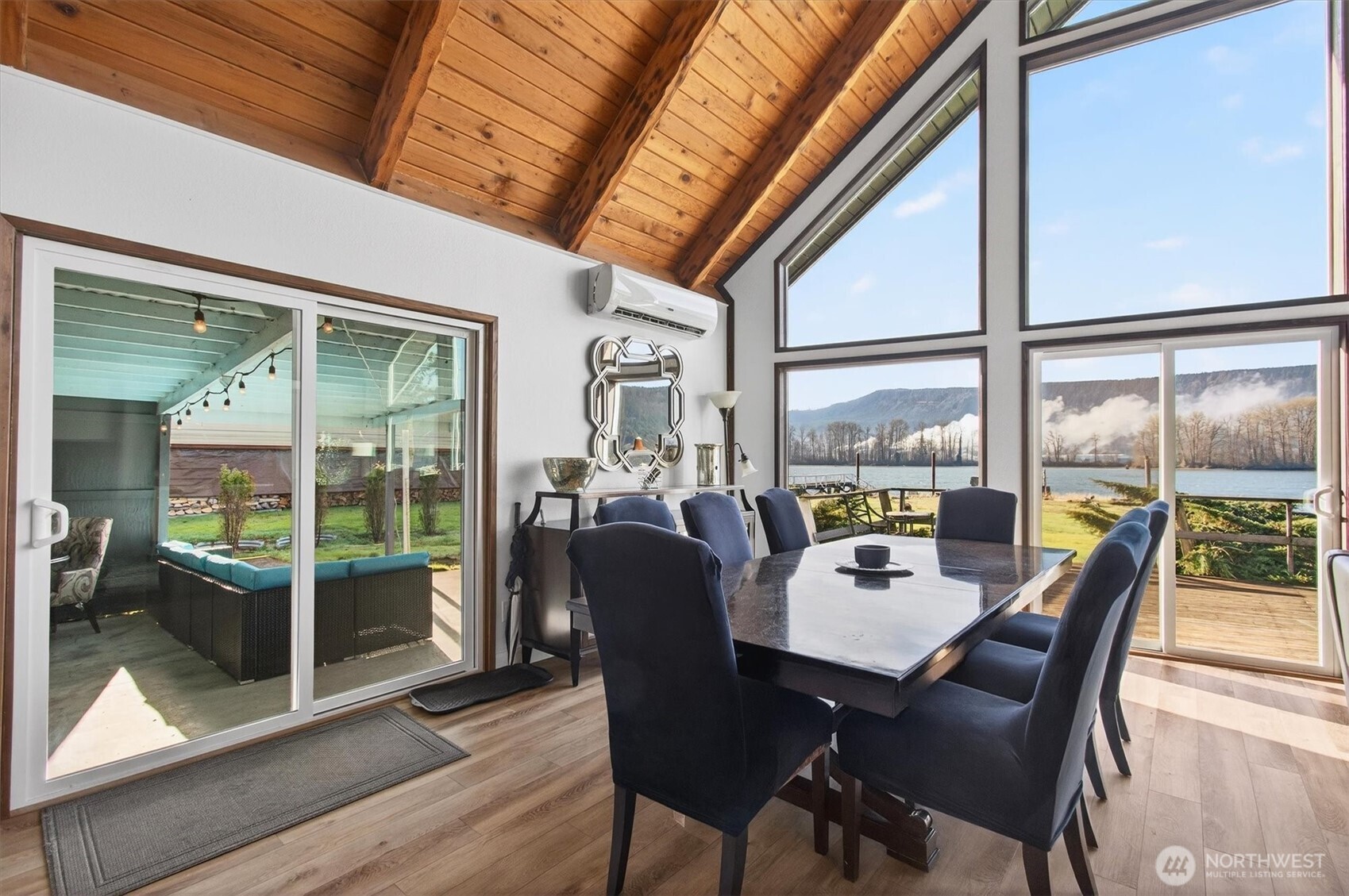301 West Sunny Sands Road Cathlamet, WA 98612 - Photo 35 of 39 a dining room with furniture garden view and wooden floor