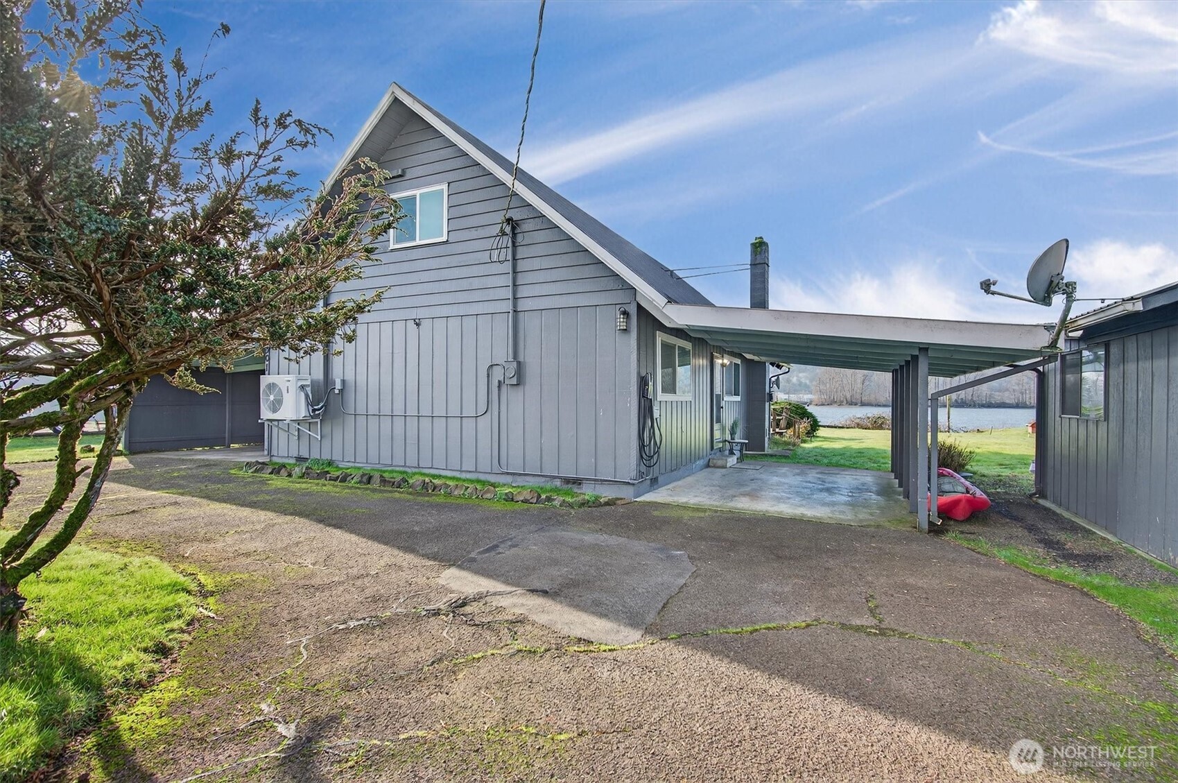 301 West Sunny Sands Road Cathlamet, WA 98612 - Photo 9 of 39 a view of a house with a patio and a yard