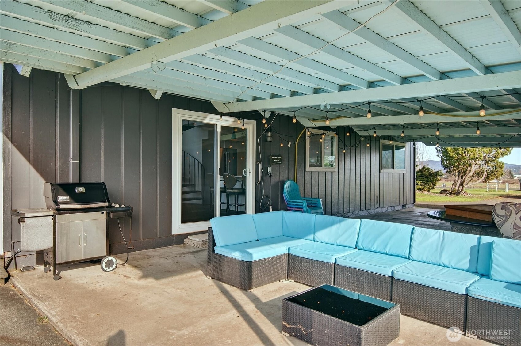 301 West Sunny Sands Road Cathlamet, WA 98612 - Photo 10 of 39 a view of a patio with couches and potted plants
