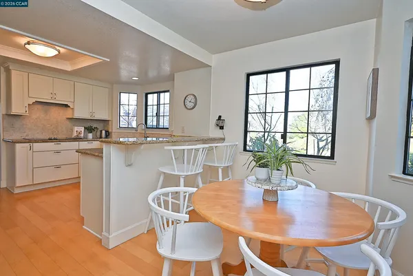 a living room with furniture cabinets and window