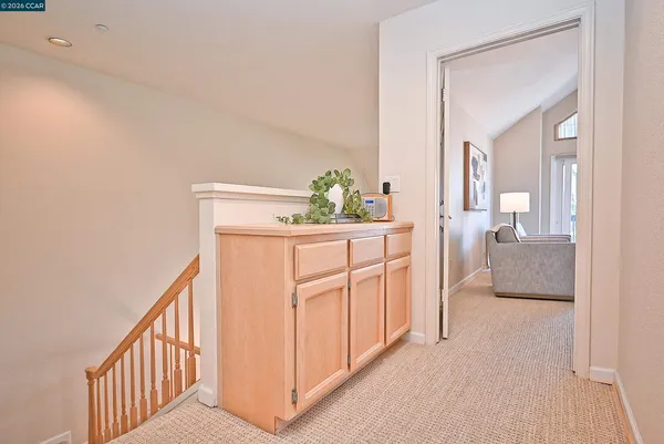 a spacious bedroom with a bed couch and a large window