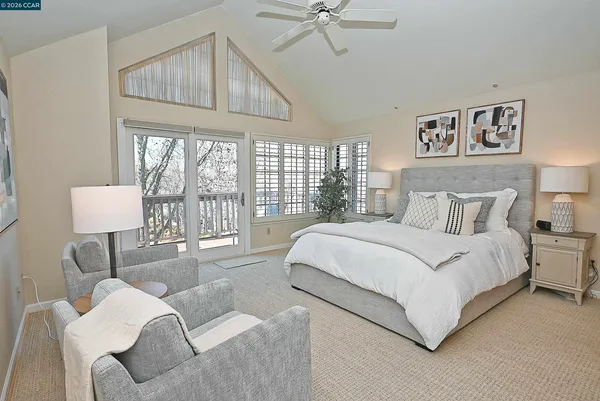 a bedroom with a bed and a lamp