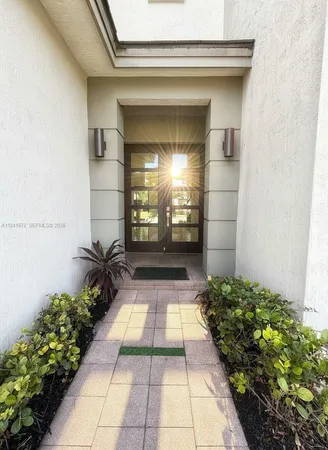 a view of entryway with flower pots
