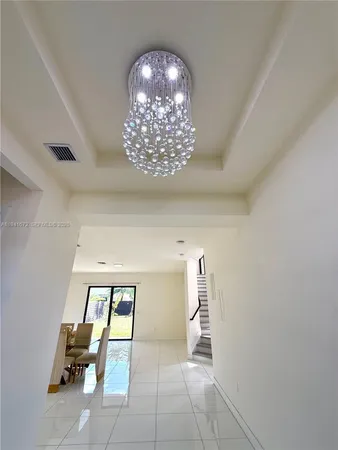 a view of a hallway with windows