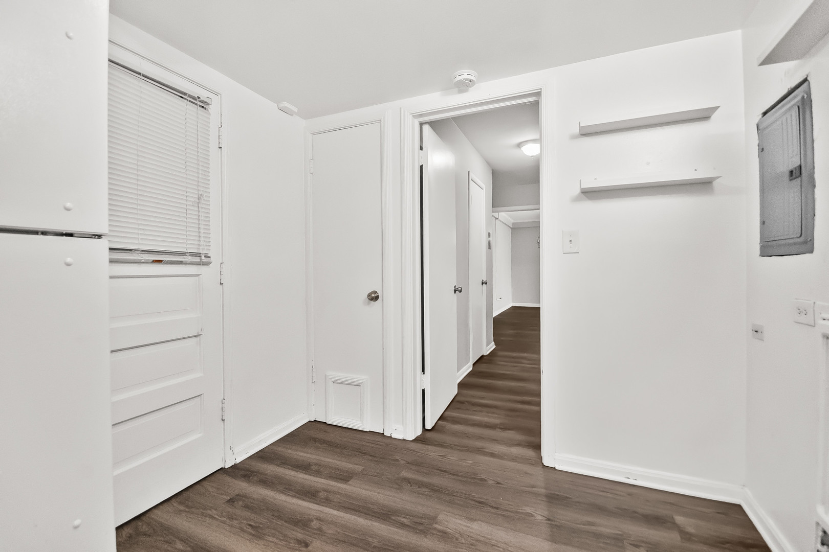 2230 Central Street, Unit G Evanston, IL 60201 - Photo 5 of 11 a view of a hallway with wooden floor and closet