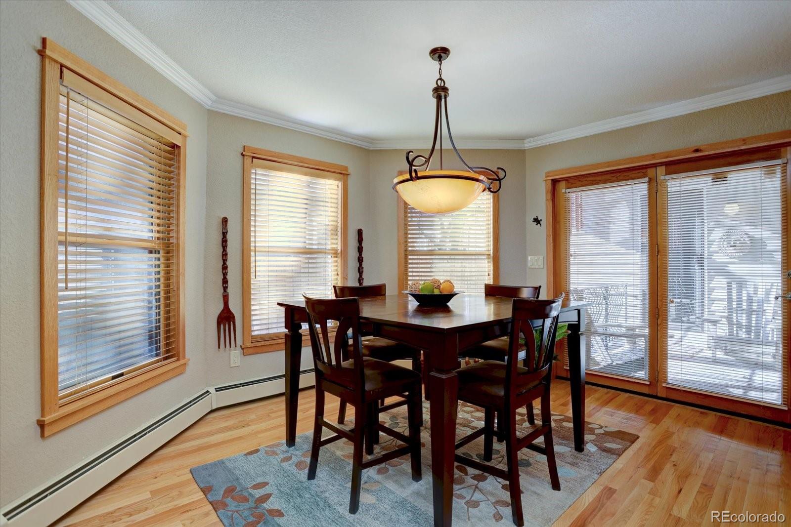 815 16th Street Boulder, CO 80302 - Photo 12 of 47 a view of a dining room with furniture window and wooden floor