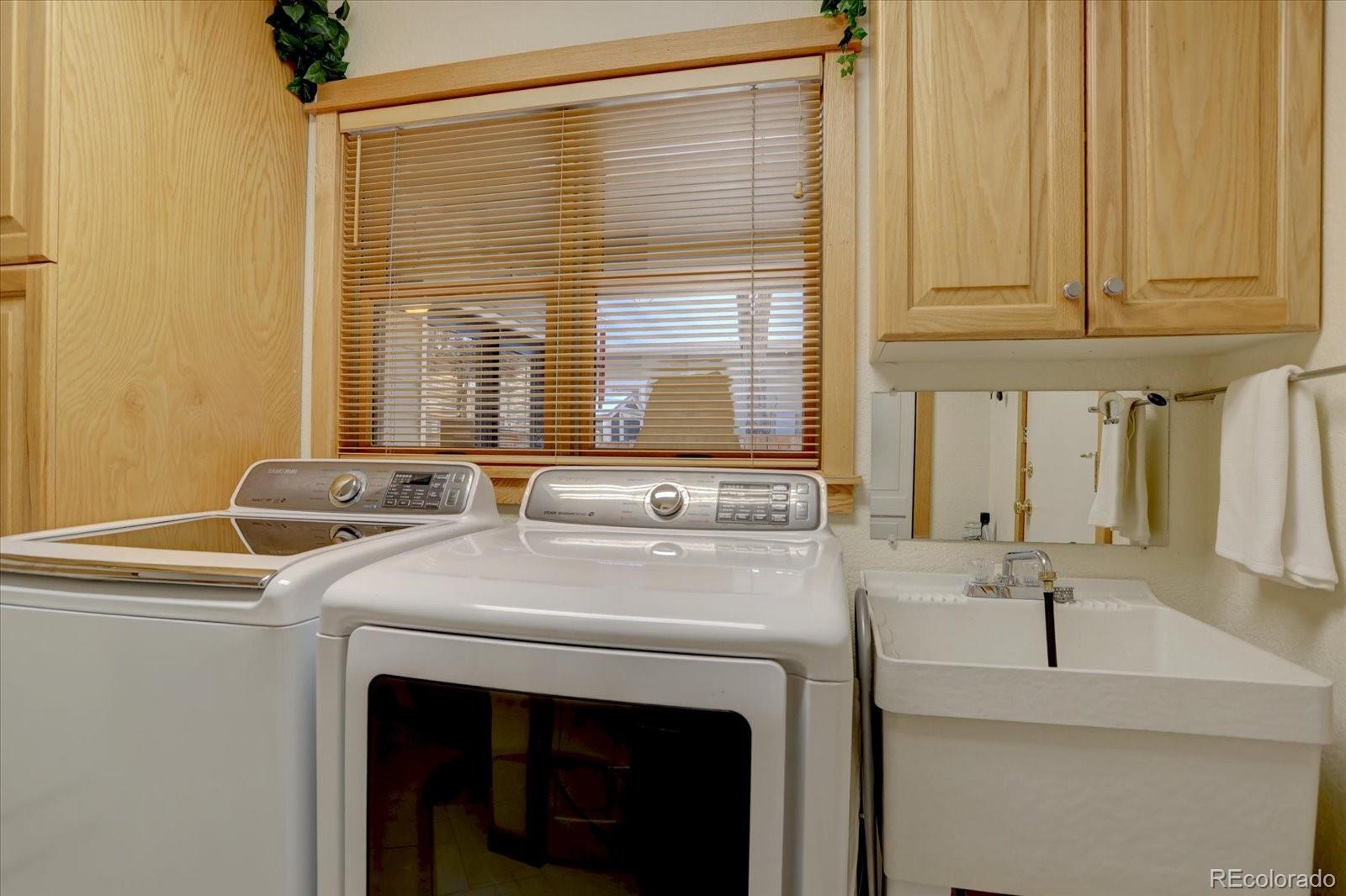 815 16th Street Boulder, CO 80302 - Photo 16 of 47 a utility room with dryer and washer