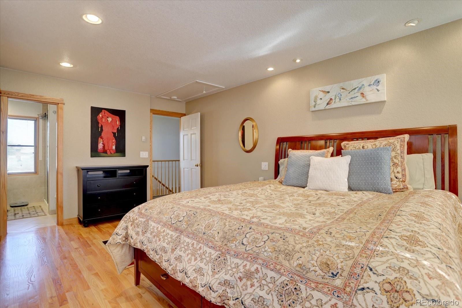 815 16th Street Boulder, CO 80302 - Photo 17 of 47 a bedroom with a bed and a flat screen tv