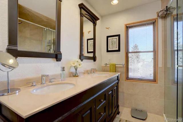 a bathroom with a sink vanity and a mirror