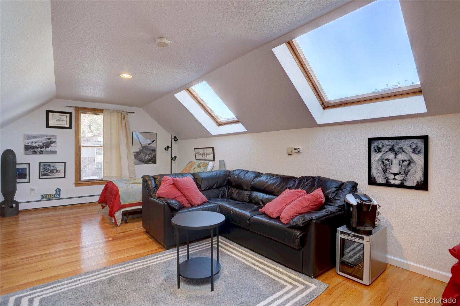 815 16th Street Boulder, CO 80302 - Photo 23 of 47 a living room with furniture and a wooden floor