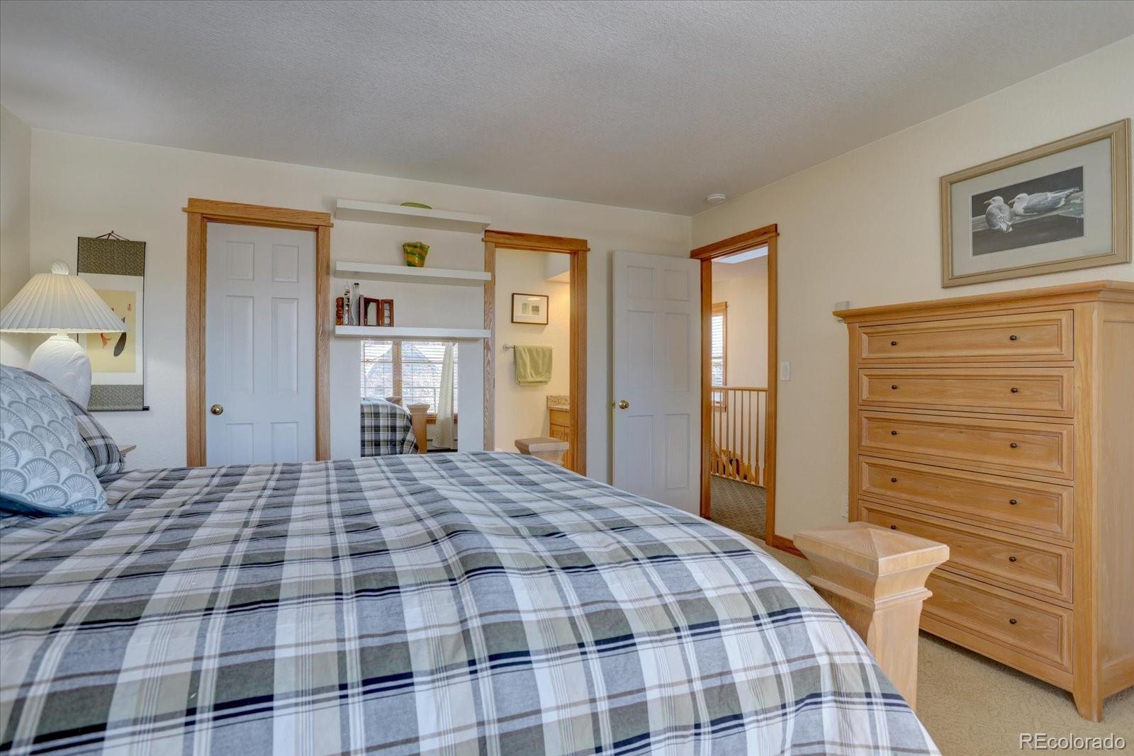 815 16th Street Boulder, CO 80302 - Photo 26 of 47 a bedroom with a bed and a window
