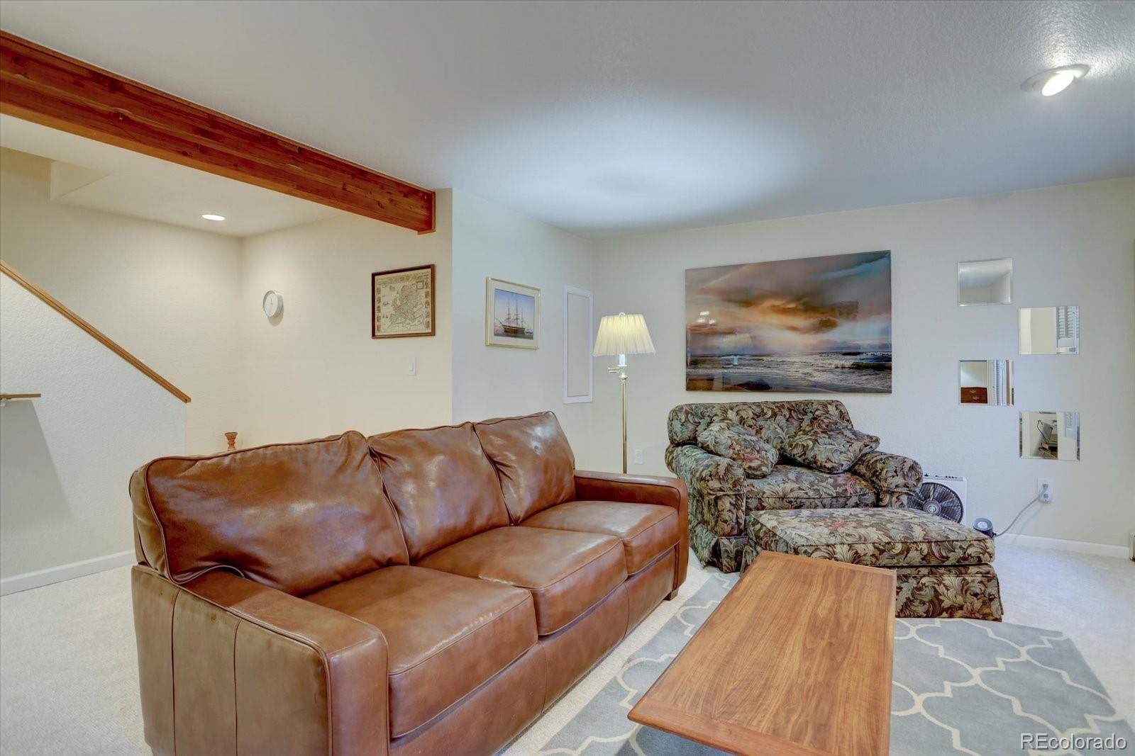 815 16th Street Boulder, CO 80302 - Photo 29 of 47 a living room with furniture and painting on the wall